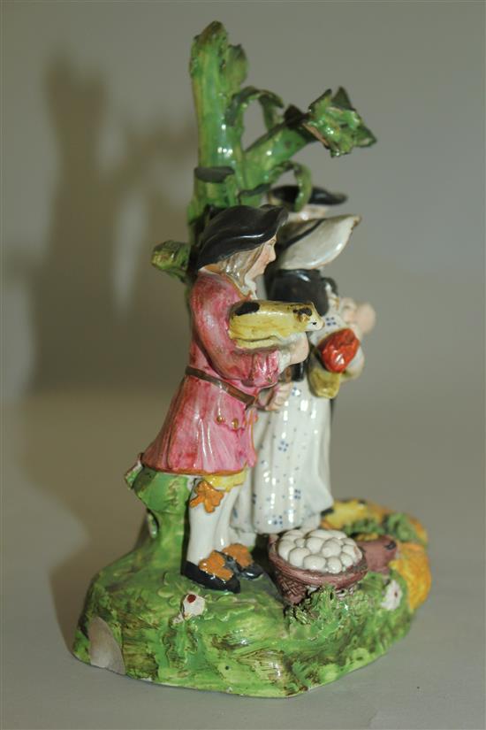 A pearlware The Tithe Pig group, early 19th century, 16cm, some losses